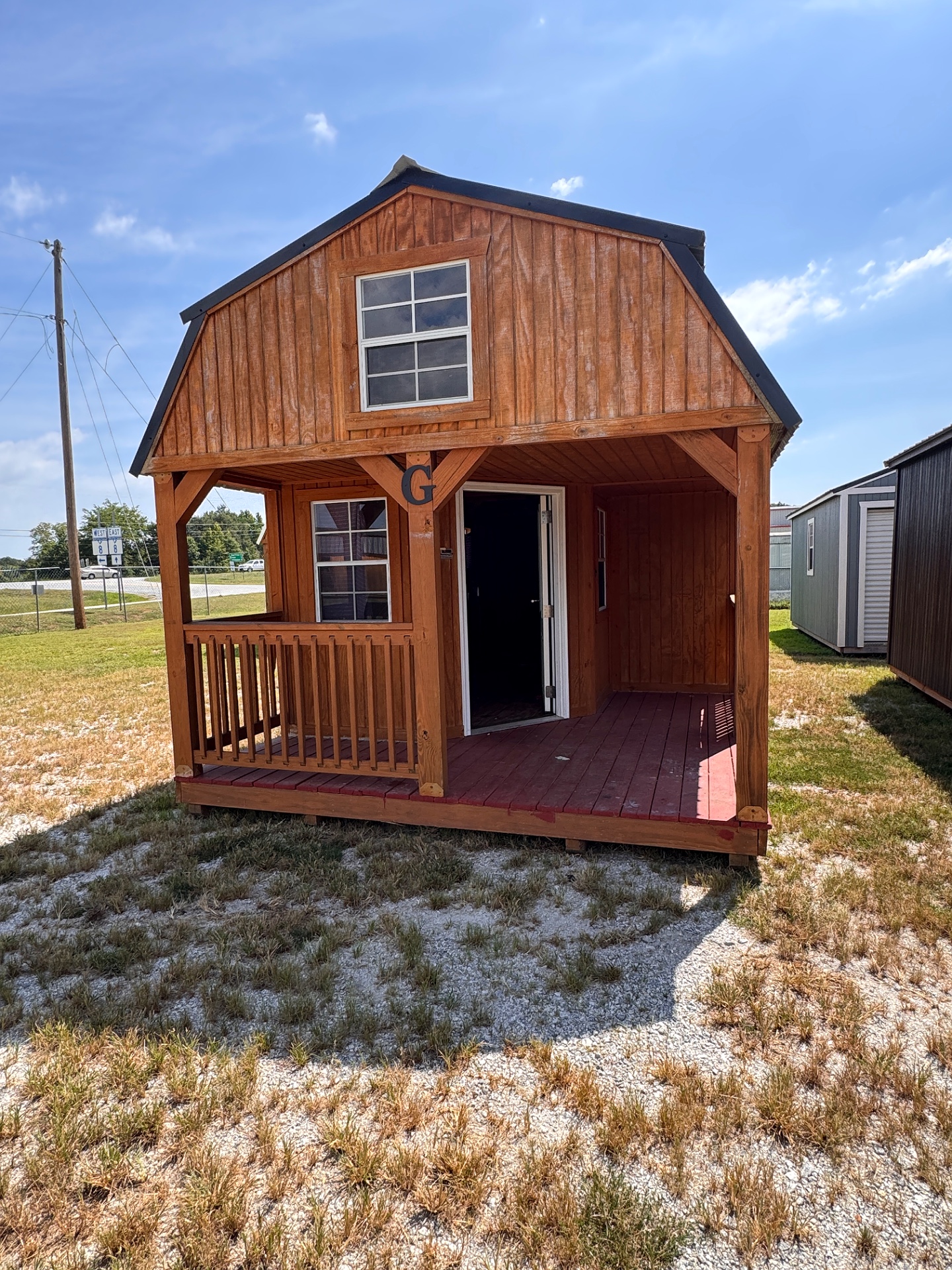 12x32 Wrap Around Porch Lofted Barn Cabin at Graceland of Cumming