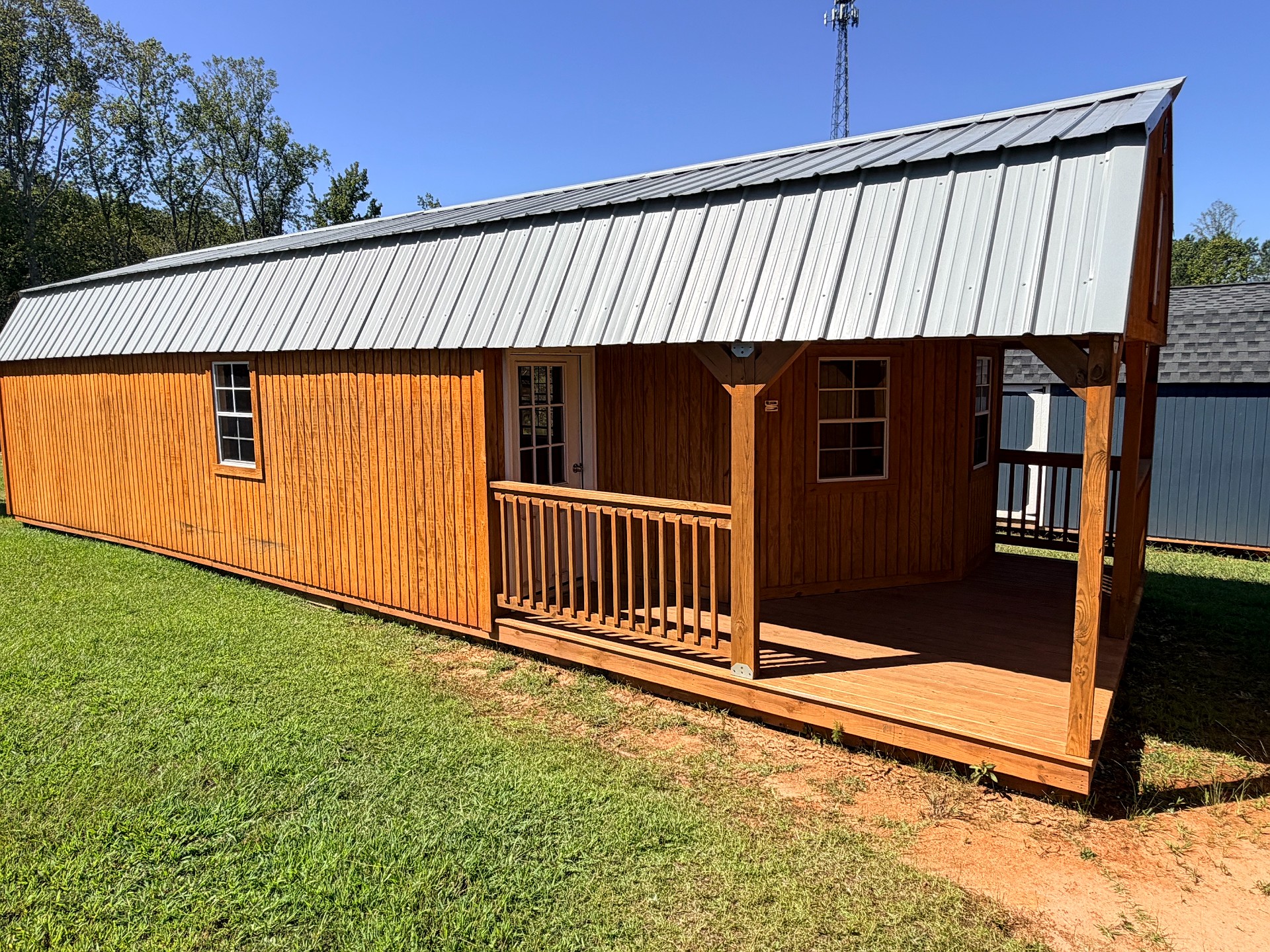 14x40 Wrap Around Porch Lofted Barn Cabin at Graceland of Cumming