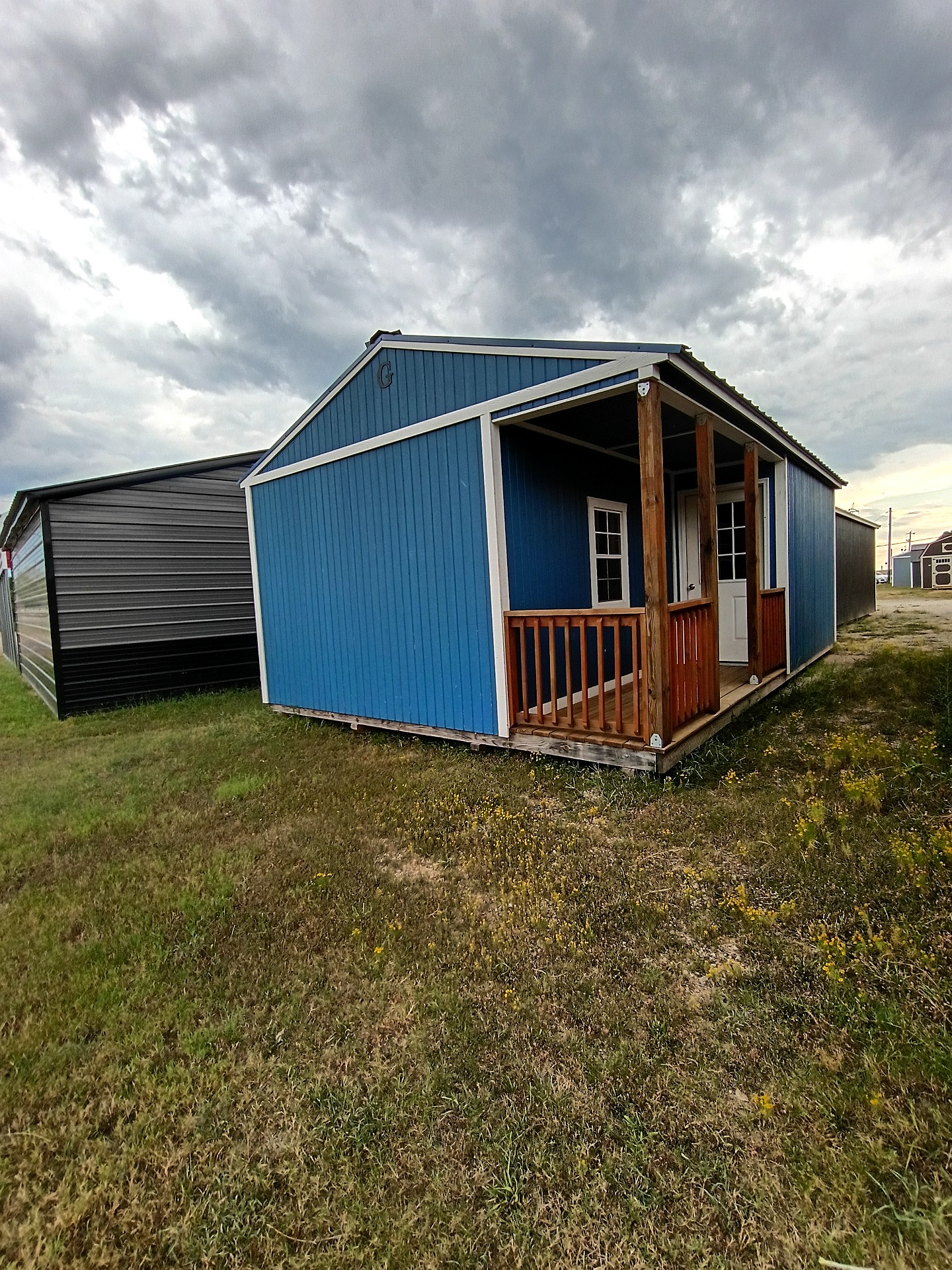 16x24 Corner Porch Cabin at Jimmy's Portable Buildings of Savannah, TN