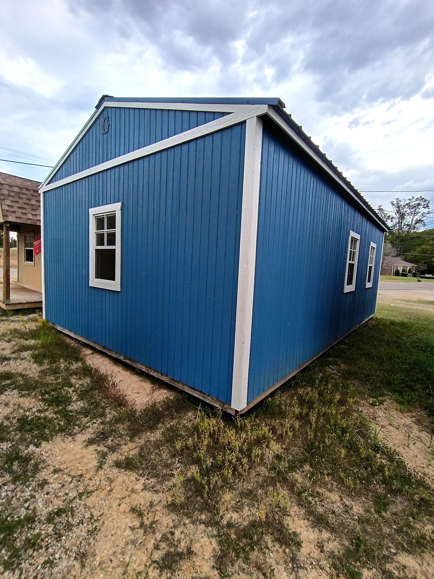 16x24 Corner Porch Cabin at Jimmy's Portable Buildings of Savannah, TN