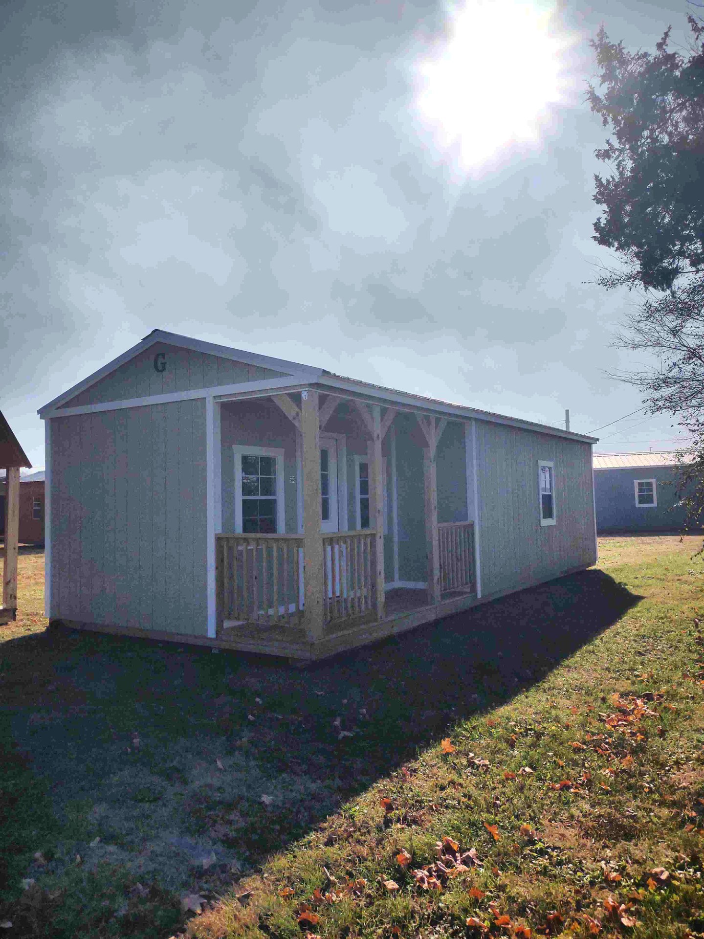 14x32 Corner Porch Cabin at Jimmy's Portable Buildings of Savannah, TN