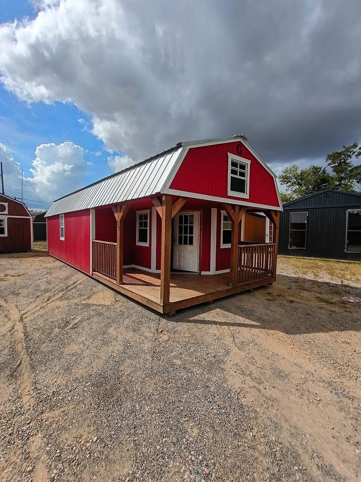 14x36 Wrap Around Porch Lofted Barn Cabin at Jimmy's Portable Buildings of Savannah, TN