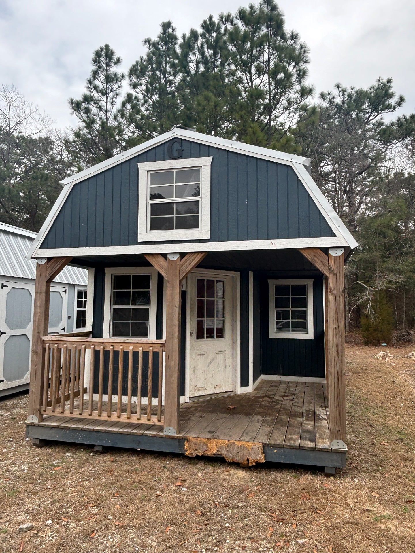 12x32 Wrap Around Porch Lofted Barn Cabin at Portable Buildings of Ravenel