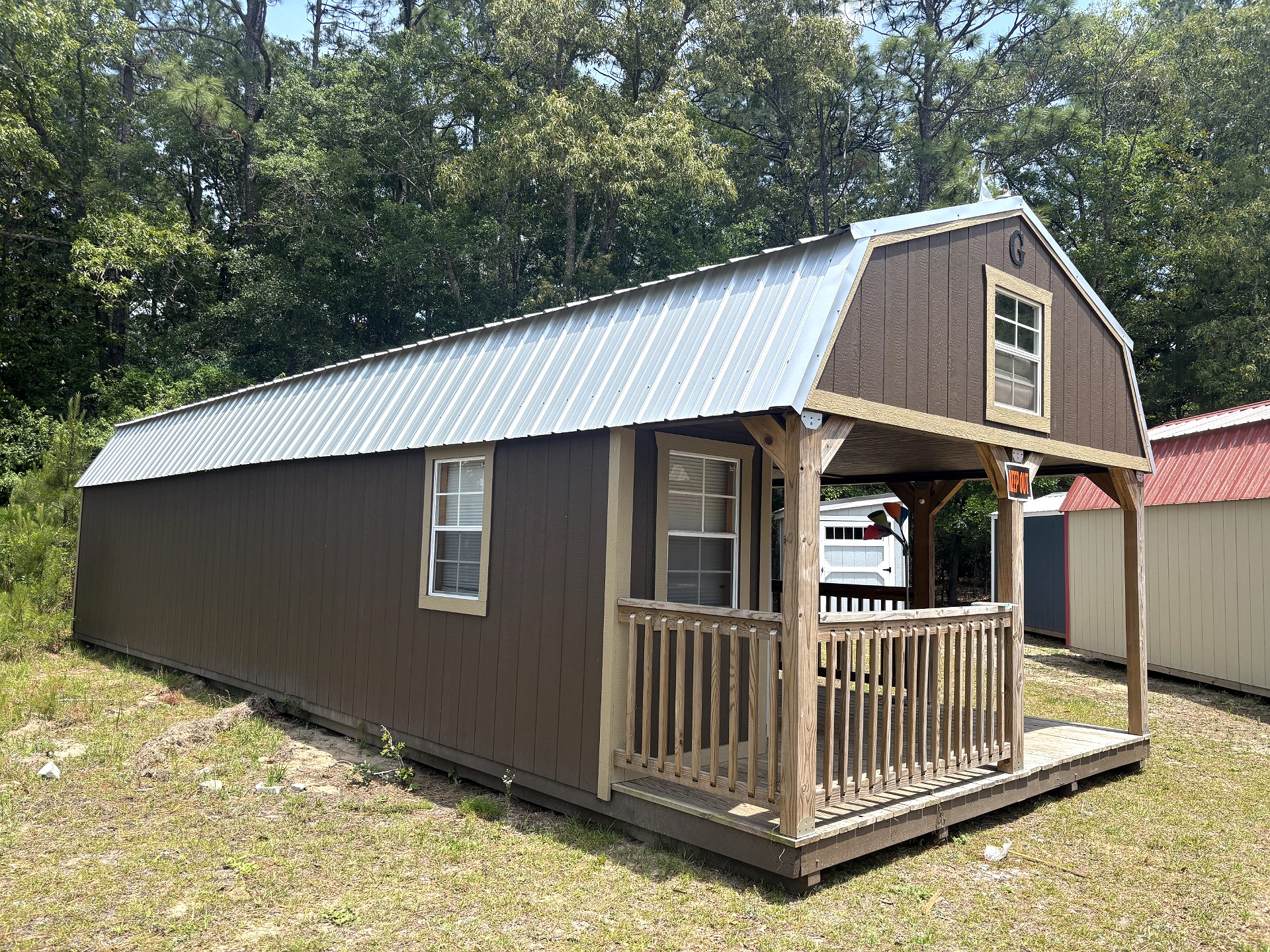 14x40 Wrap Around Porch Lofted Barn Cabin at Portable Buildings of Ravenel