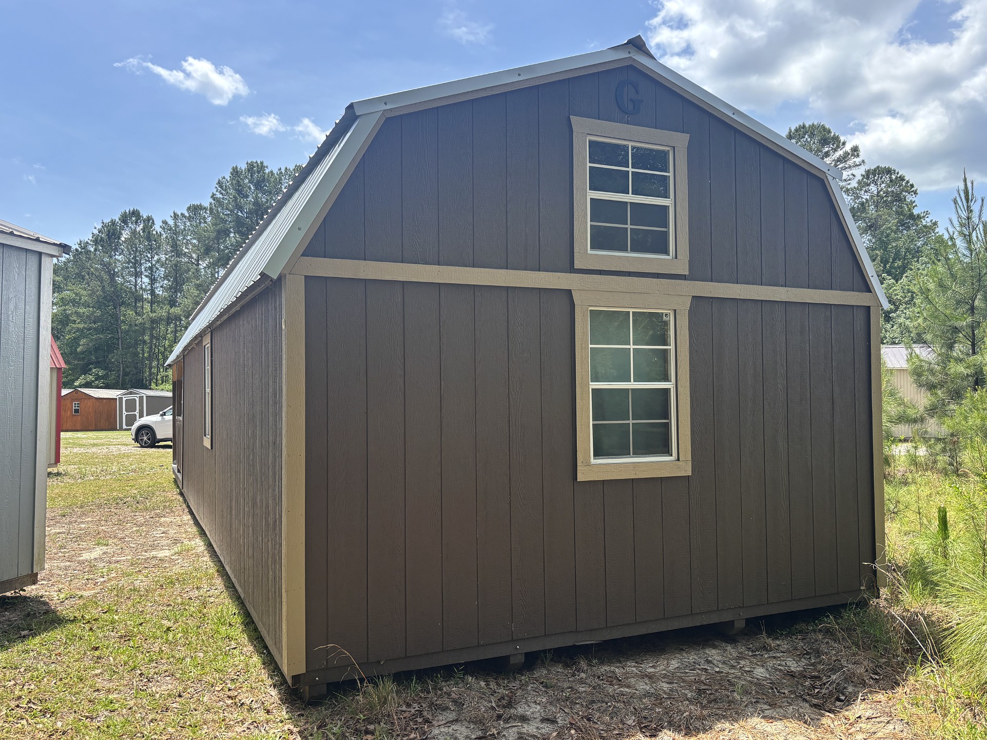 14x40 Wrap Around Porch Lofted Barn Cabin at Portable Buildings of Ravenel