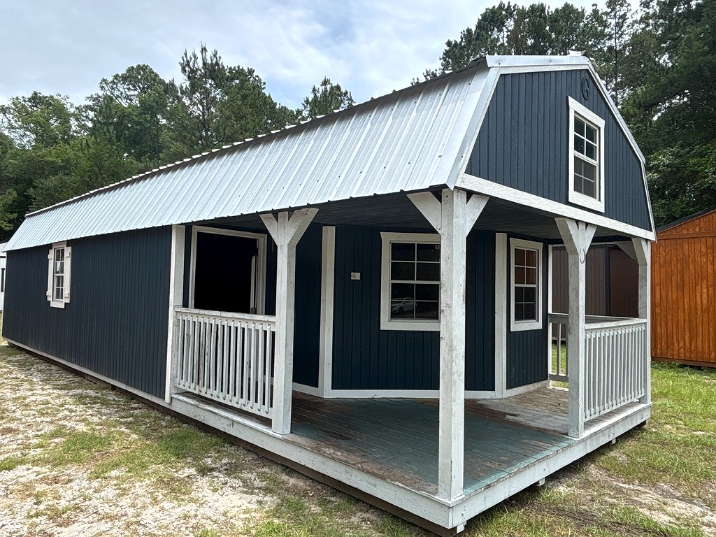 14x40 Wrap Around Porch Lofted Barn Cabin at Portable Buildings of Ravenel