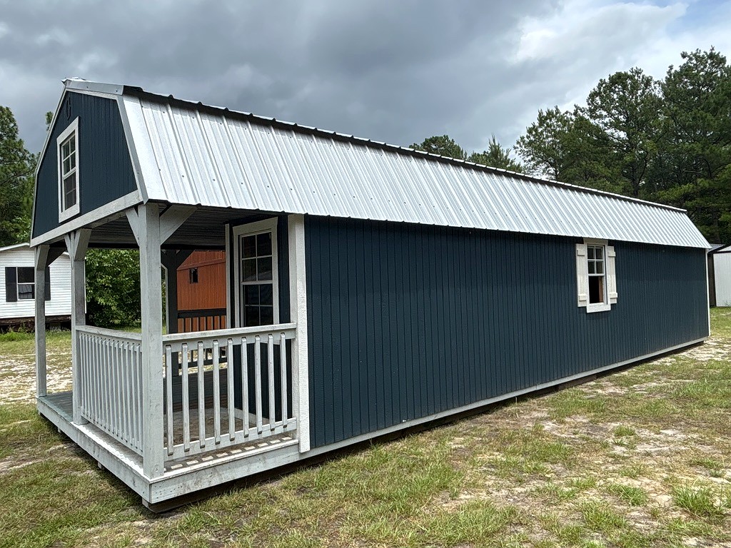 14x40 Wrap Around Porch Lofted Barn Cabin at Portable Buildings of Ravenel