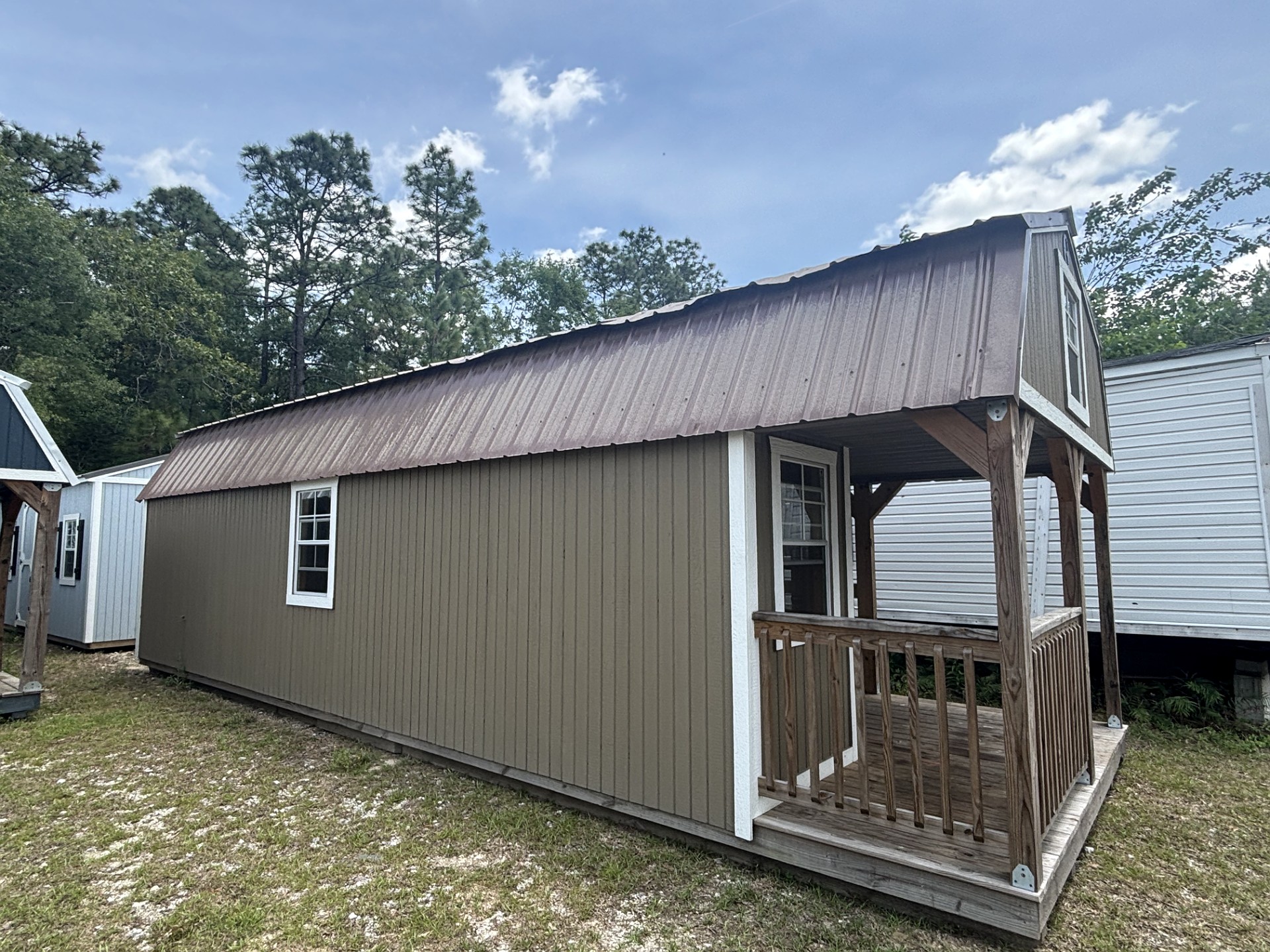 12x32 Wrap Around Porch Lofted Barn Cabin at Portable Buildings of Ravenel