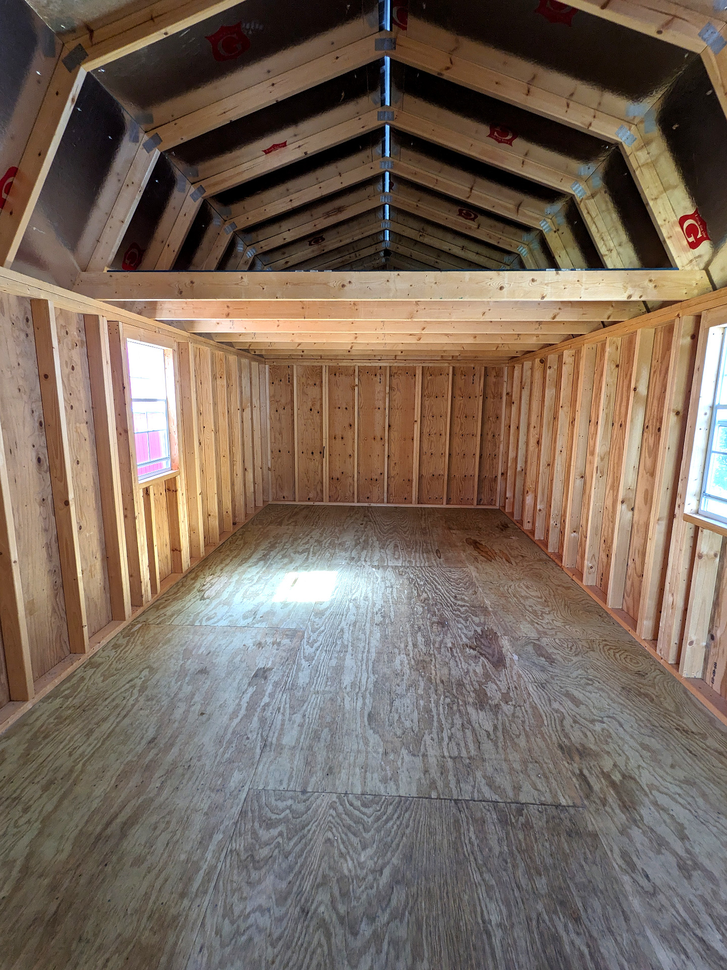 12x32 Wrap Around Porch Lofted Barn Cabin at Graceland Storage Sheds and Buildings of Kingsland