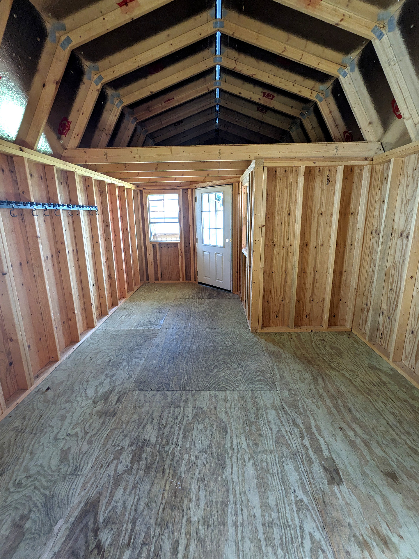 12x32 Wrap Around Porch Lofted Barn Cabin at Graceland Storage Sheds and Buildings of Kingsland