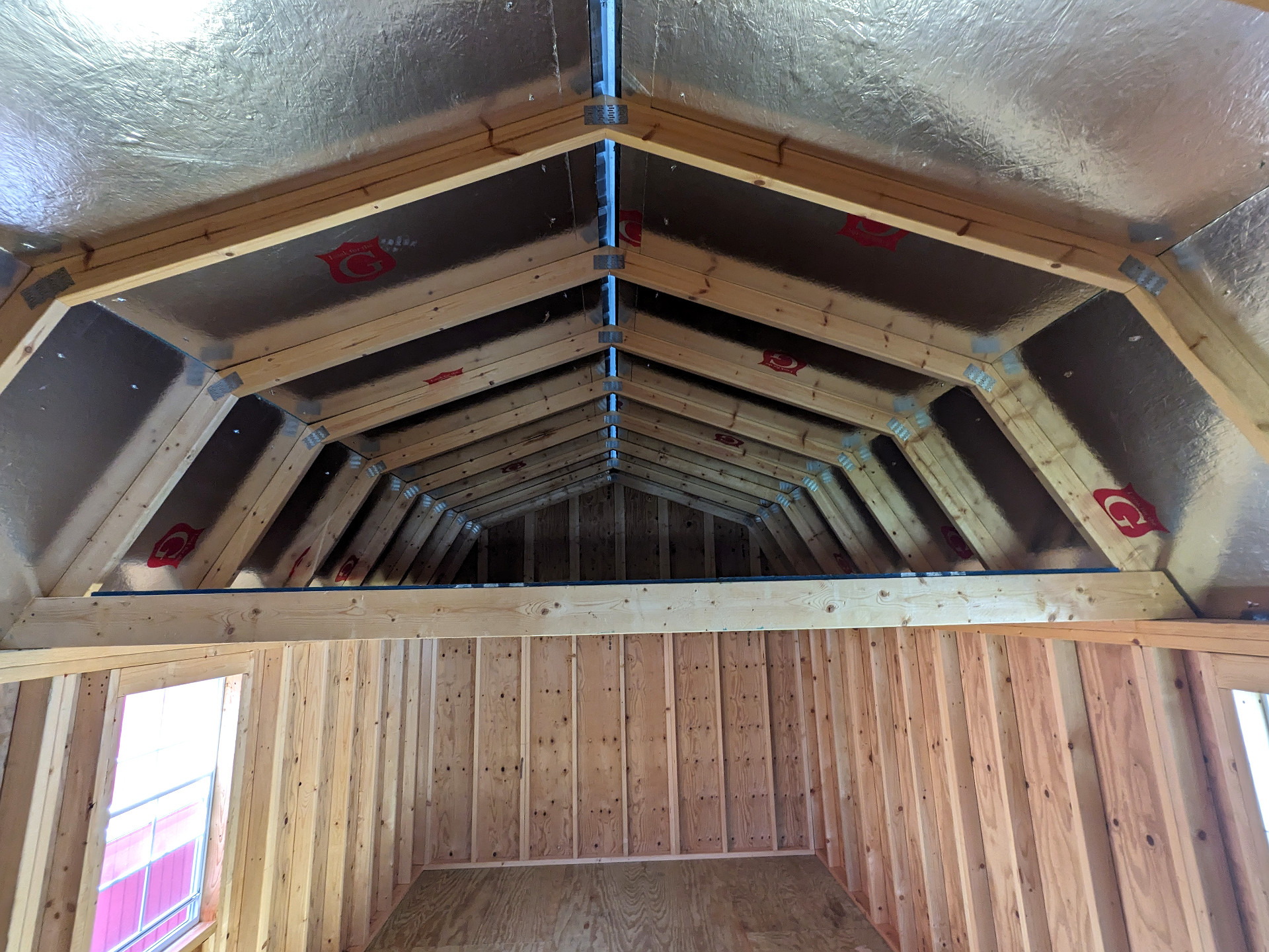 12x32 Wrap Around Porch Lofted Barn Cabin at Graceland Storage Sheds and Buildings of Kingsland