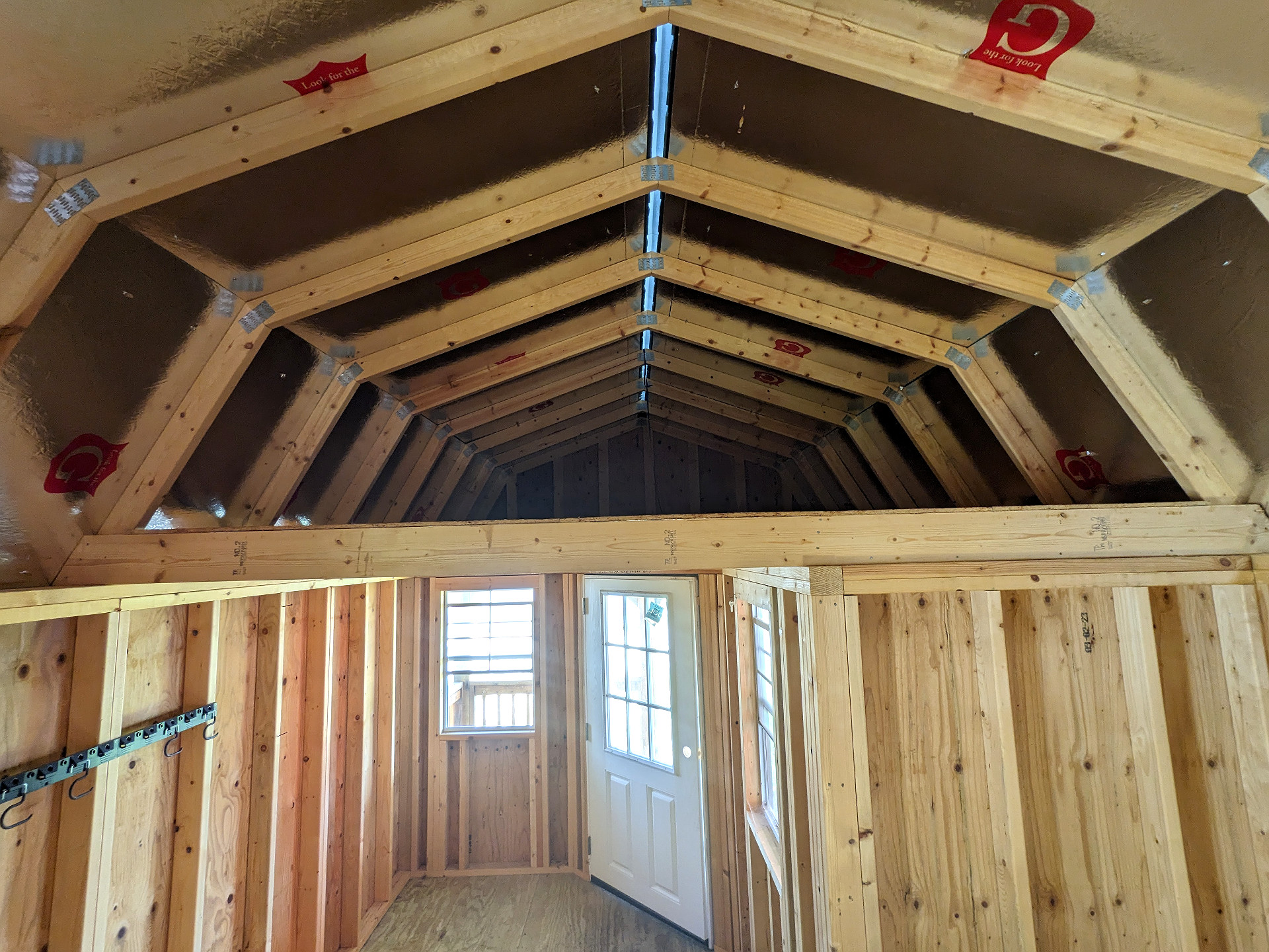 12x32 Wrap Around Porch Lofted Barn Cabin at Graceland Storage Sheds and Buildings of Kingsland
