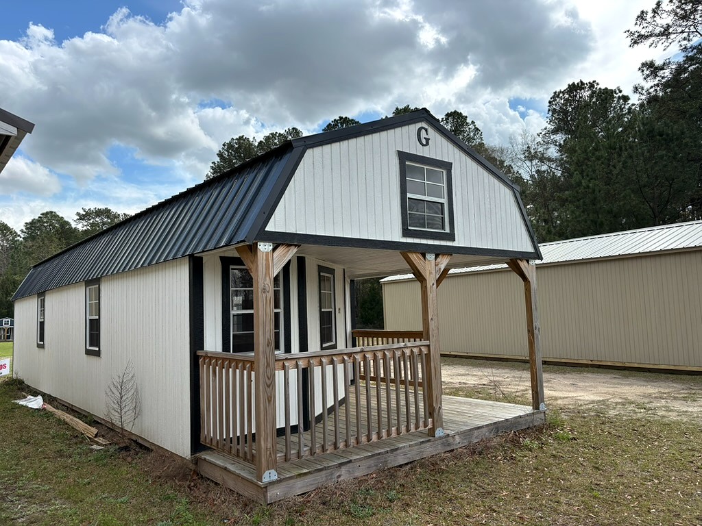 14x40 Wrap Around Porch Lofted Barn Cabin at Portable Buildings of Ravenel
