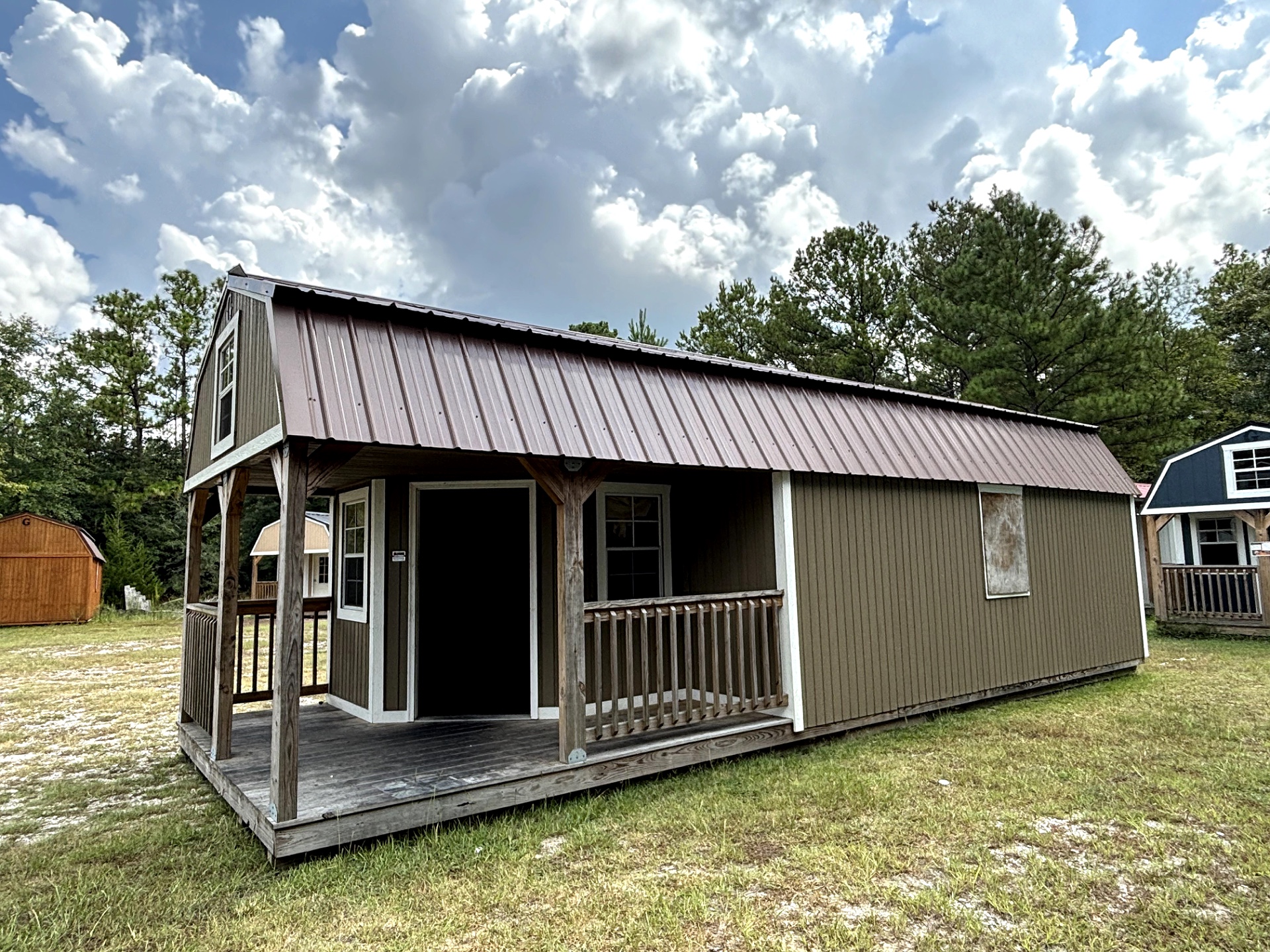 12x32 Wrap Around Porch Lofted Barn Cabin at Portable Buildings of Ravenel