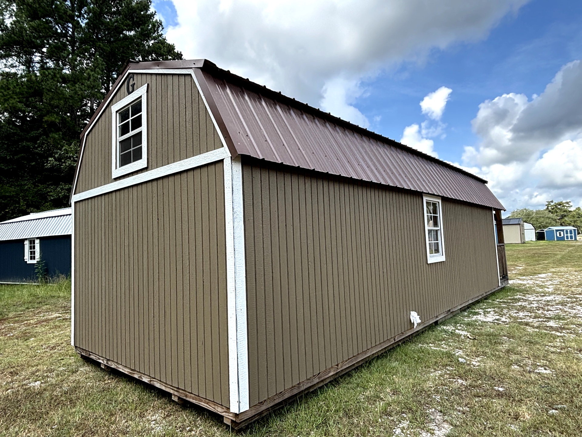 12x32 Wrap Around Porch Lofted Barn Cabin at Portable Buildings of Ravenel