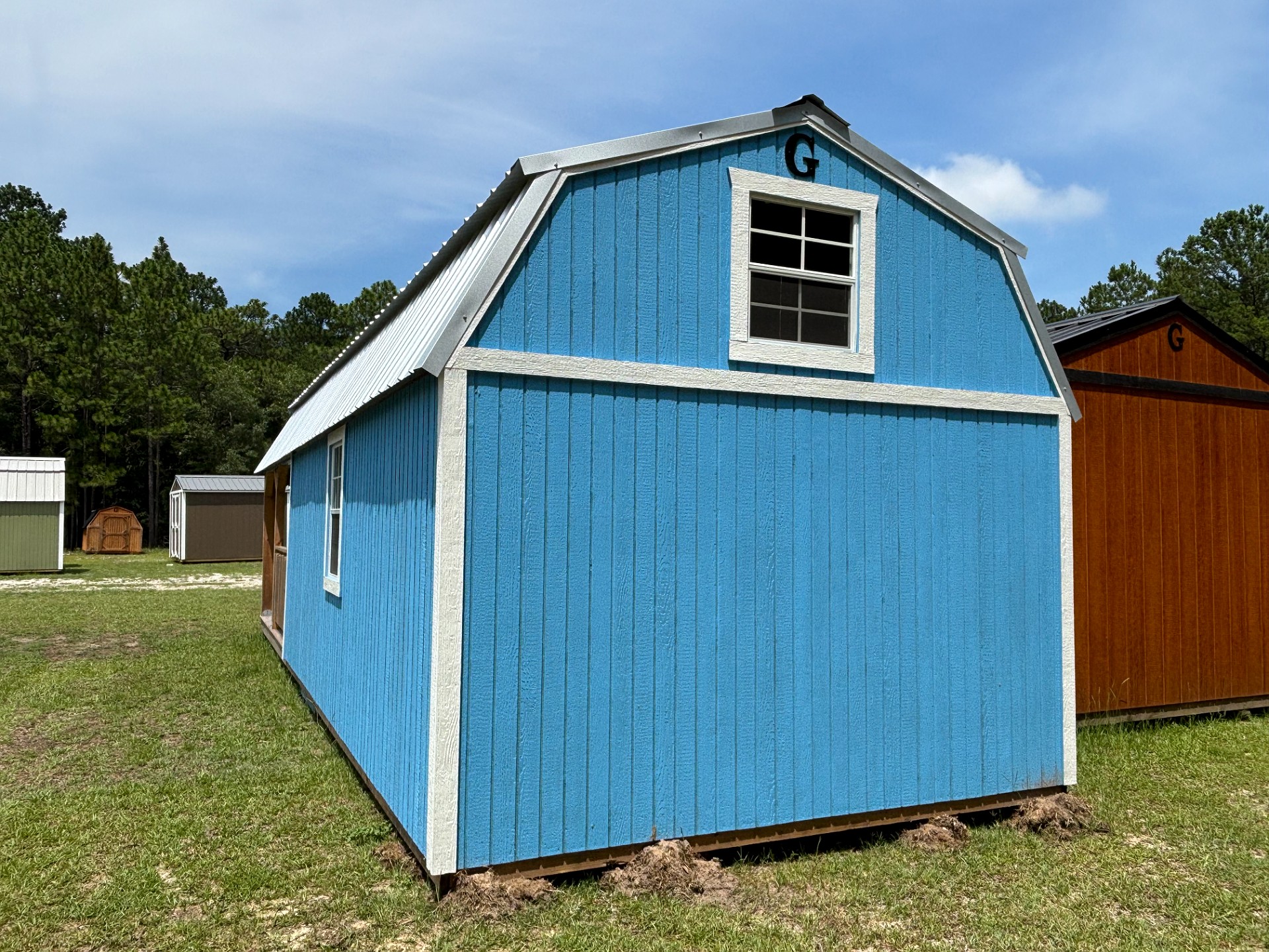 12x32 Wrap Around Porch Lofted Barn Cabin at Portable Buildings of Ravenel