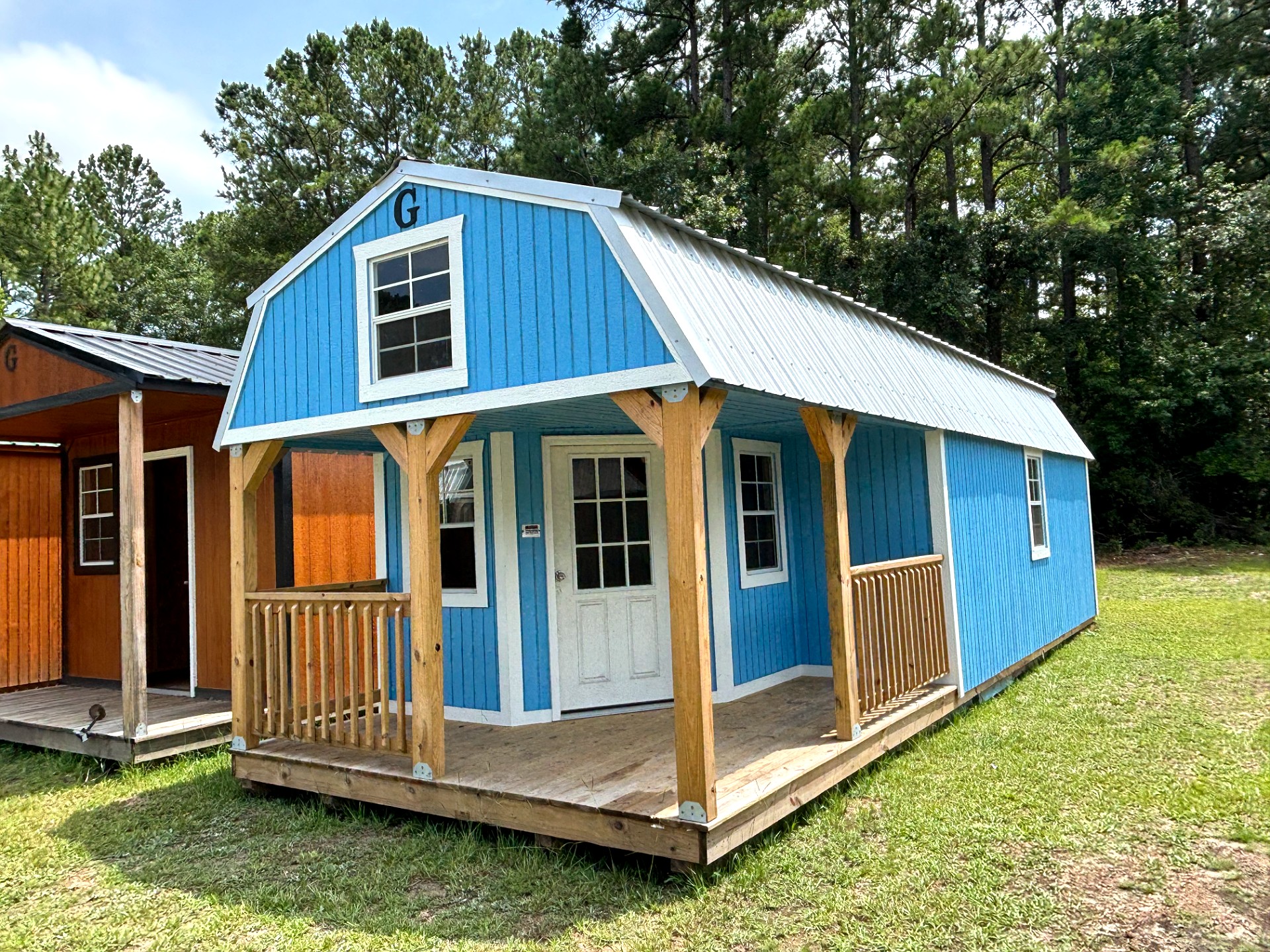 12x32 Wrap Around Porch Lofted Barn Cabin at Portable Buildings of Ravenel