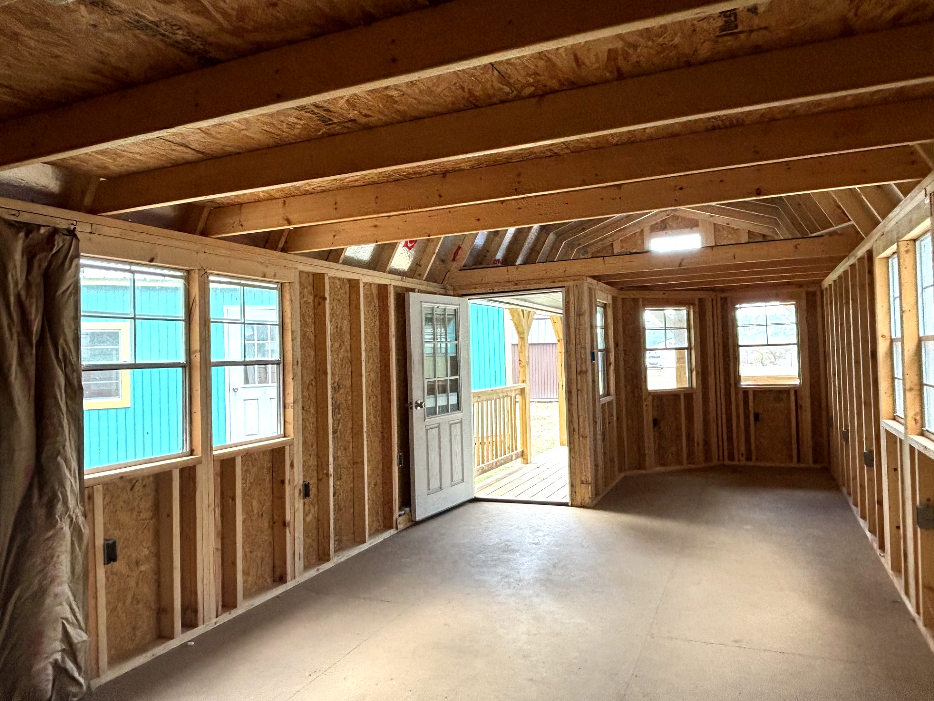 12x32 Wrap Around Porch Lofted Barn Cabin at Portable Buildings of Ravenel