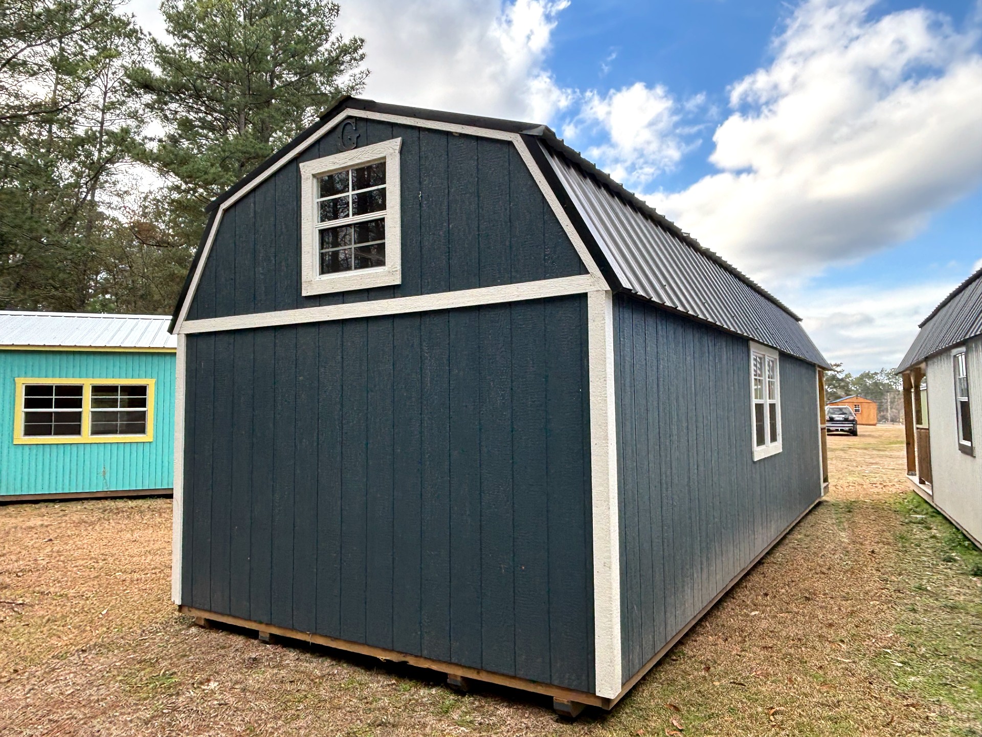 12x32 Wrap Around Porch Lofted Barn Cabin at Portable Buildings of Ravenel