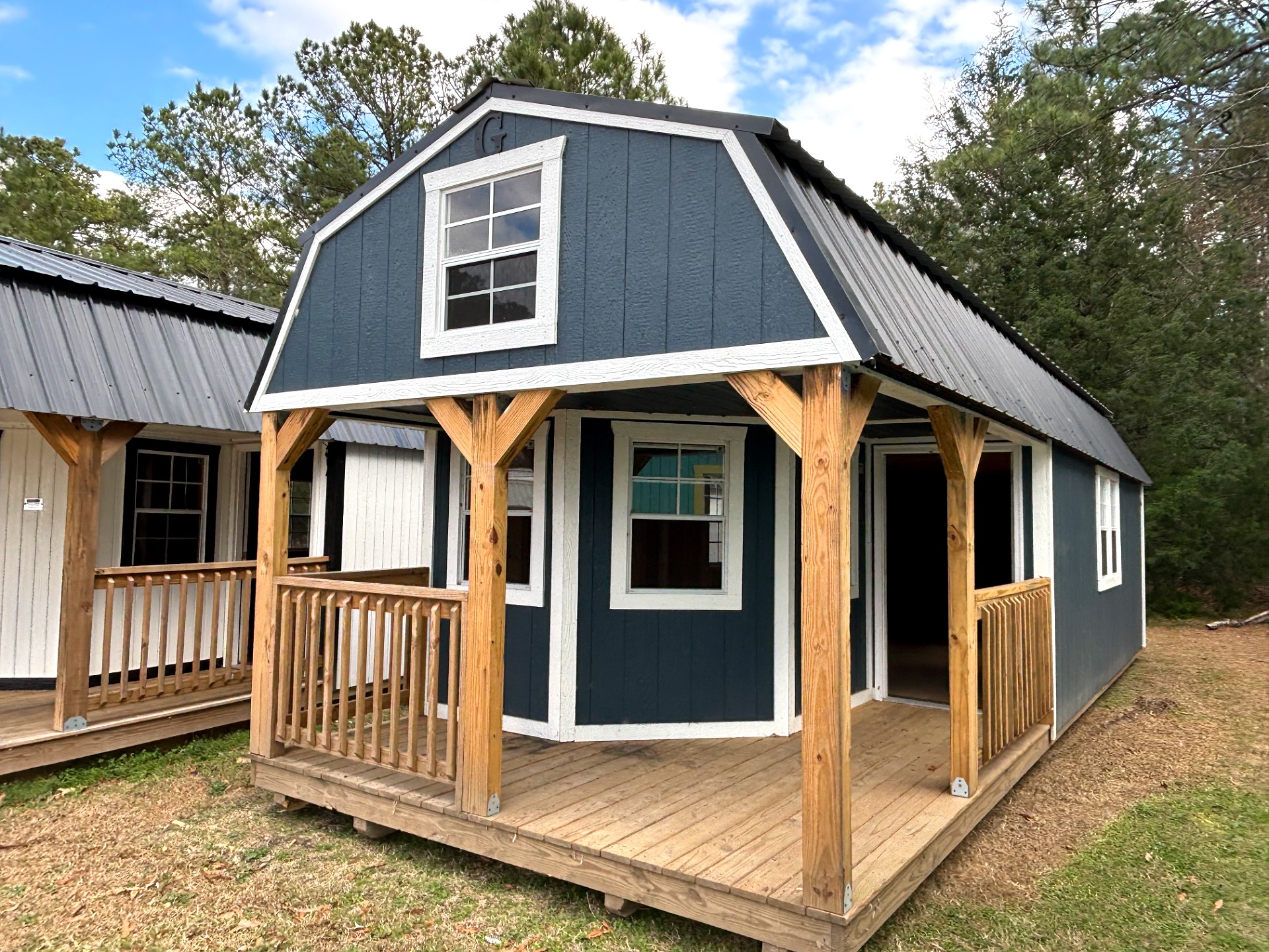 12x32 Wrap Around Porch Lofted Barn Cabin at Portable Buildings of Ravenel