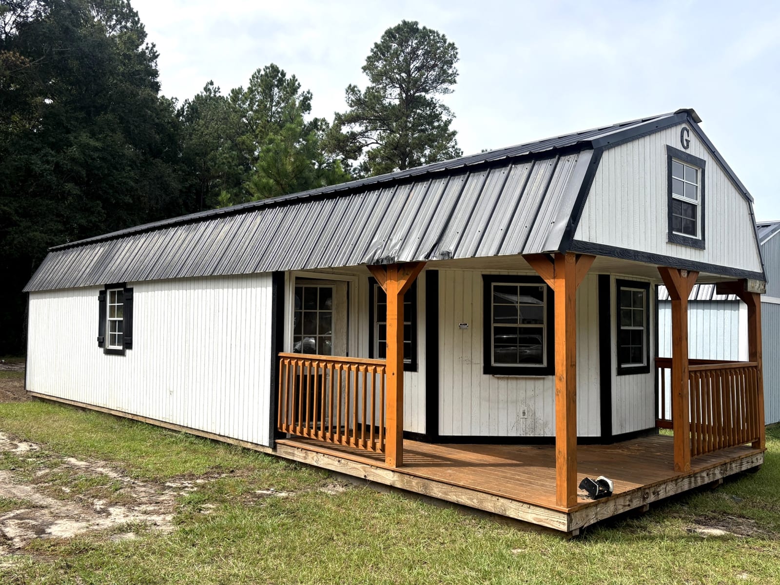14x40 Wrap Around Porch Lofted Barn Cabin at Portable Buildings of Ravenel