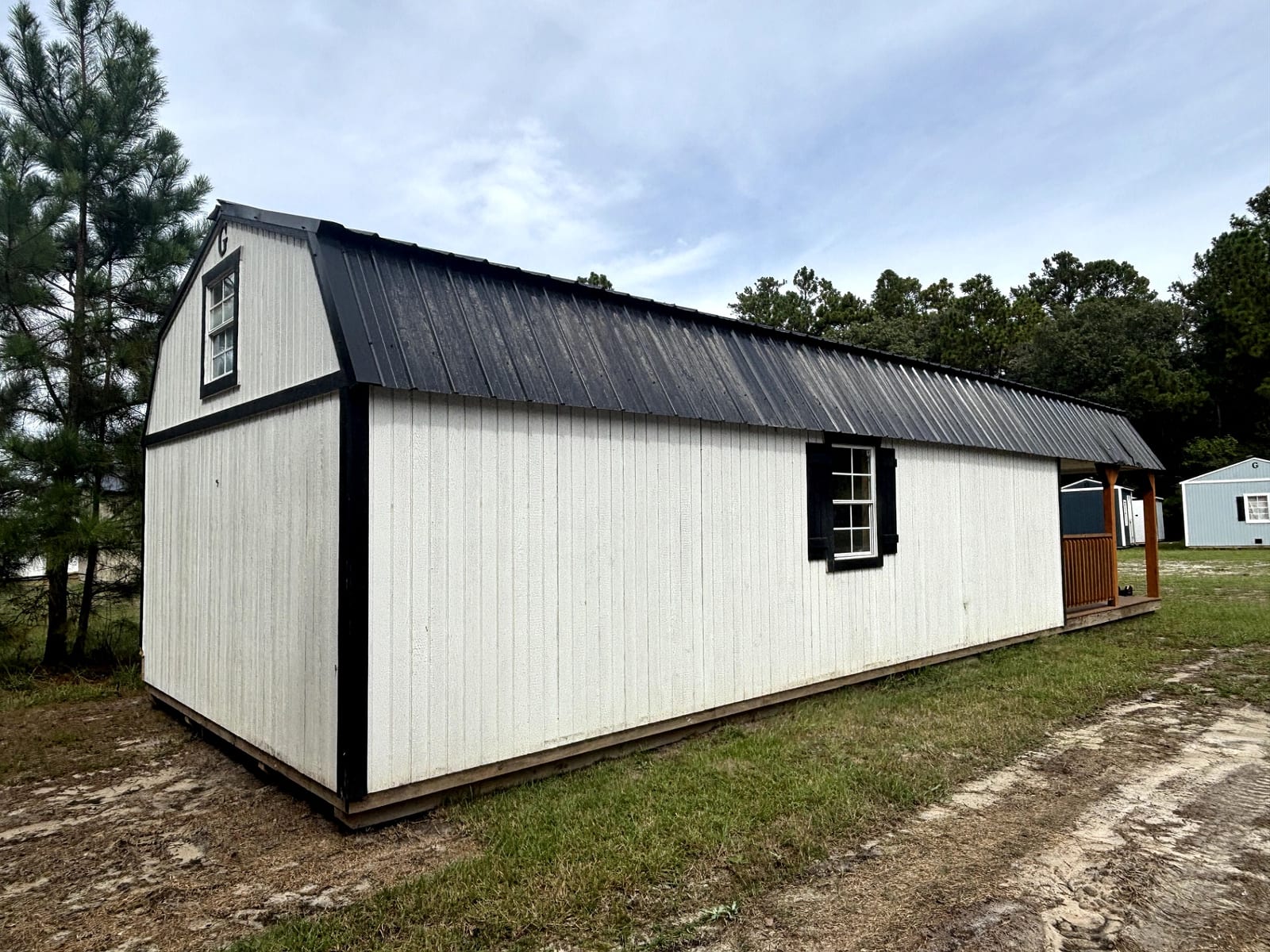 14x40 Wrap Around Porch Lofted Barn Cabin at Portable Buildings of Ravenel