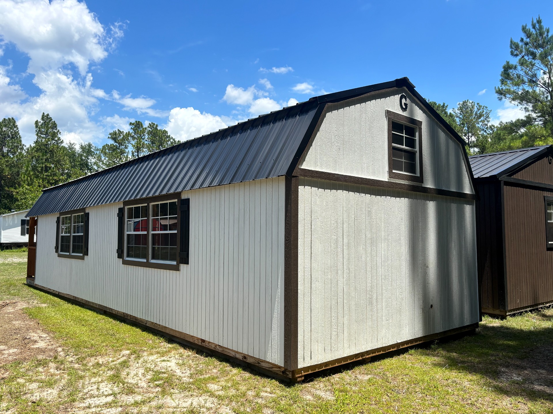 14x40 Wrap Around Porch Lofted Barn Cabin at Portable Buildings of Ravenel