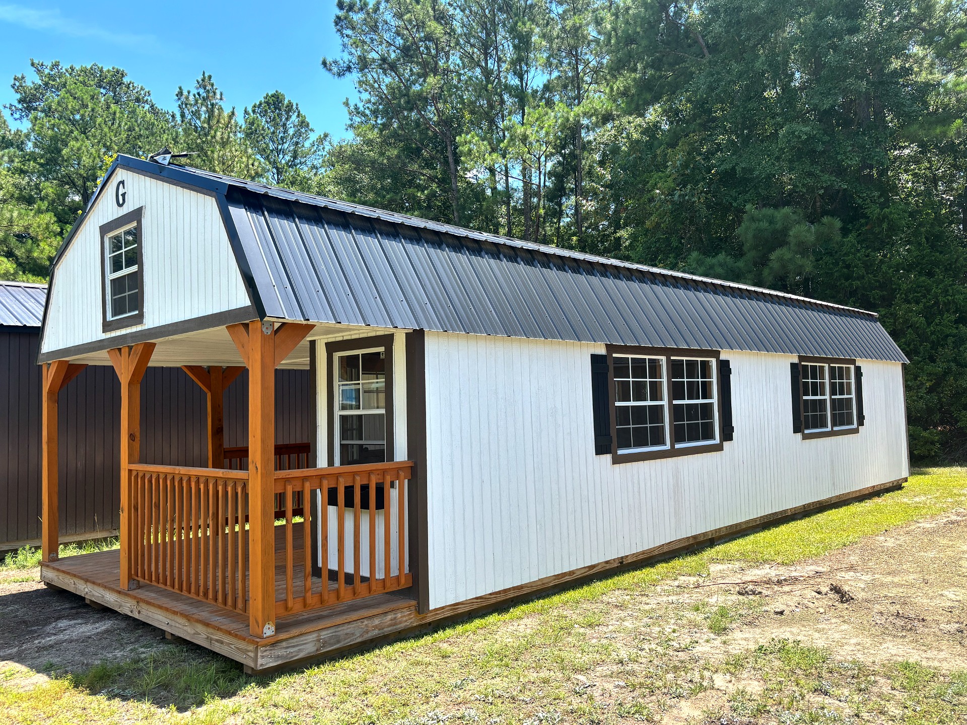 14x40 Wrap Around Porch Lofted Barn Cabin at Portable Buildings of Ravenel