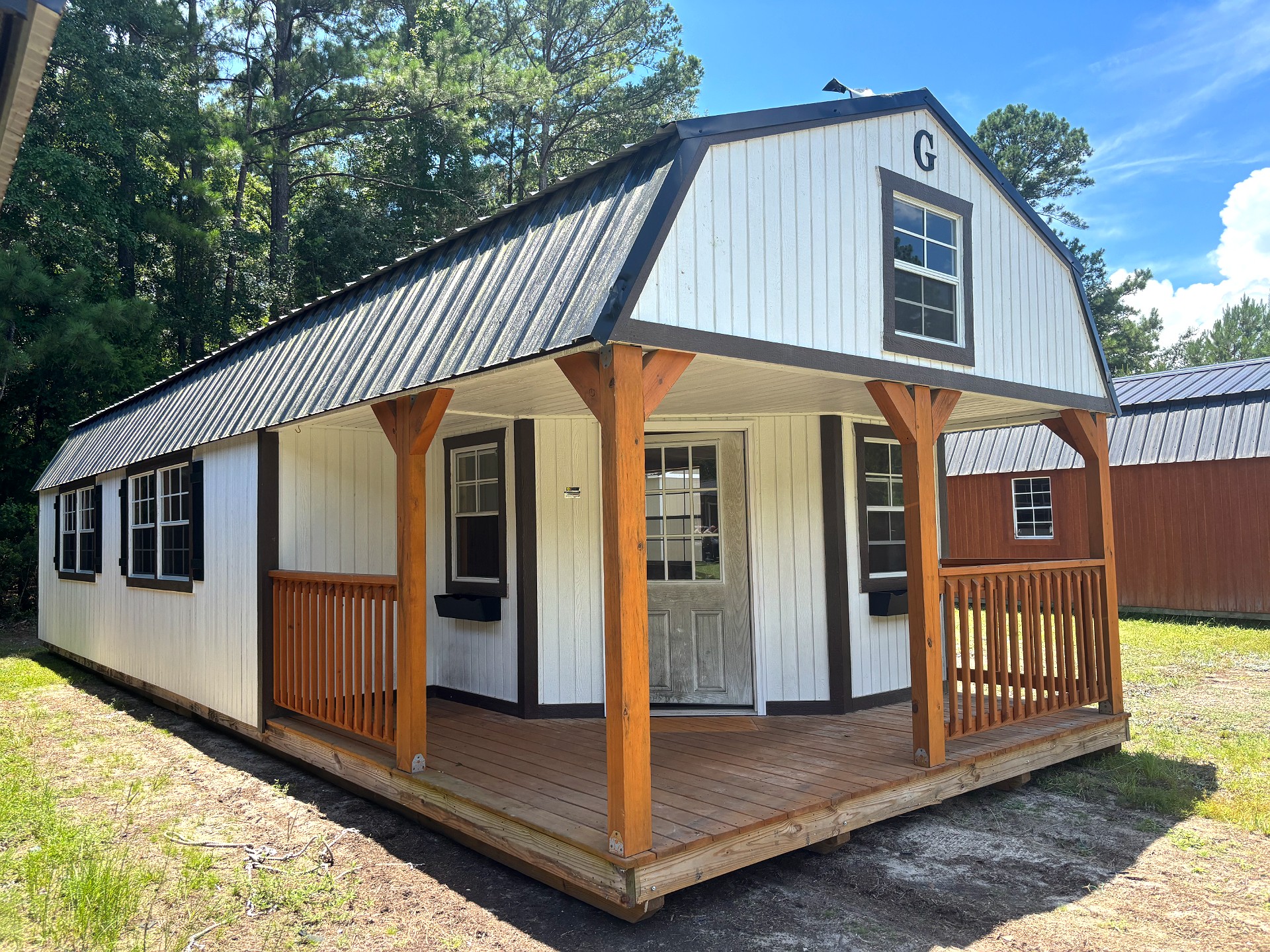 14x40 Wrap Around Porch Lofted Barn Cabin at Portable Buildings of Ravenel