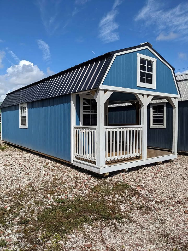 12x32 Wrap Around Porch Lofted Barn Cabin at Graceland Storage Sheds and Buildings of Kingsland