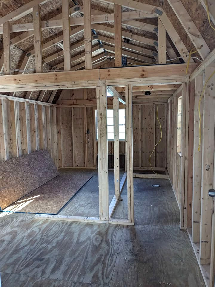 12x32 Wrap Around Porch Lofted Barn Cabin at Graceland Storage Sheds and Buildings of Kingsland