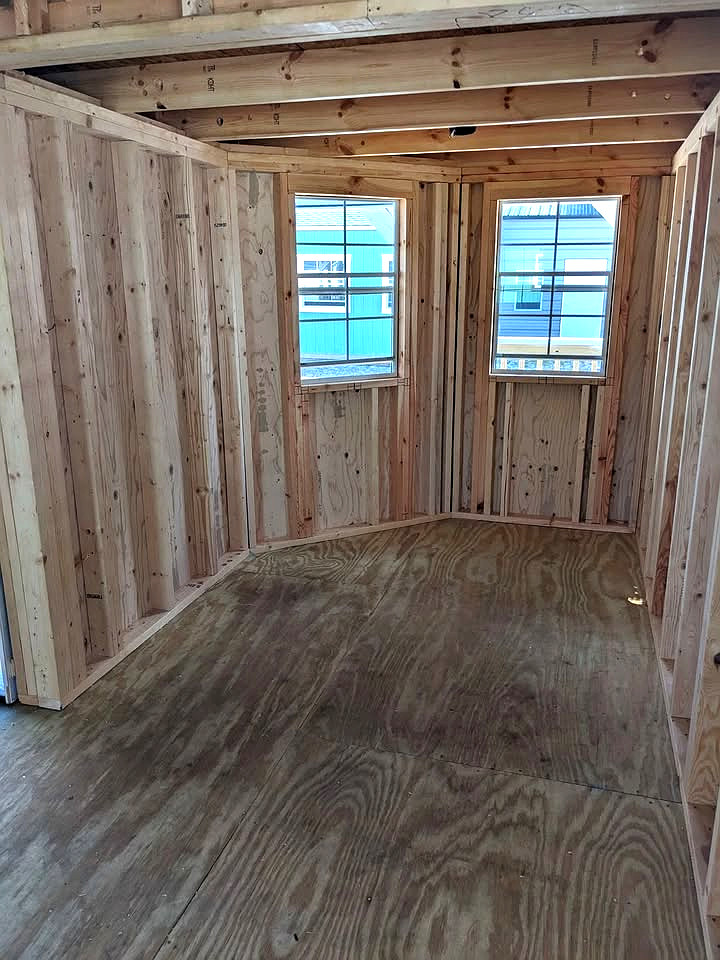 12x32 Wrap Around Porch Lofted Barn Cabin at Graceland Storage Sheds and Buildings of Kingsland
