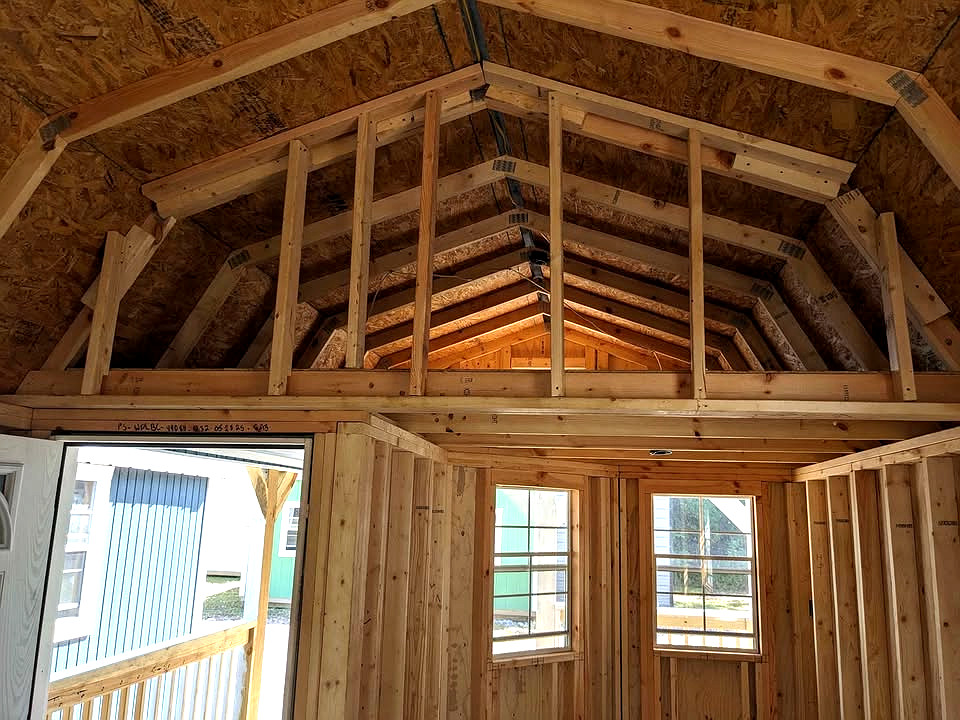 12x32 Wrap Around Porch Lofted Barn Cabin at Graceland Storage Sheds and Buildings of Kingsland