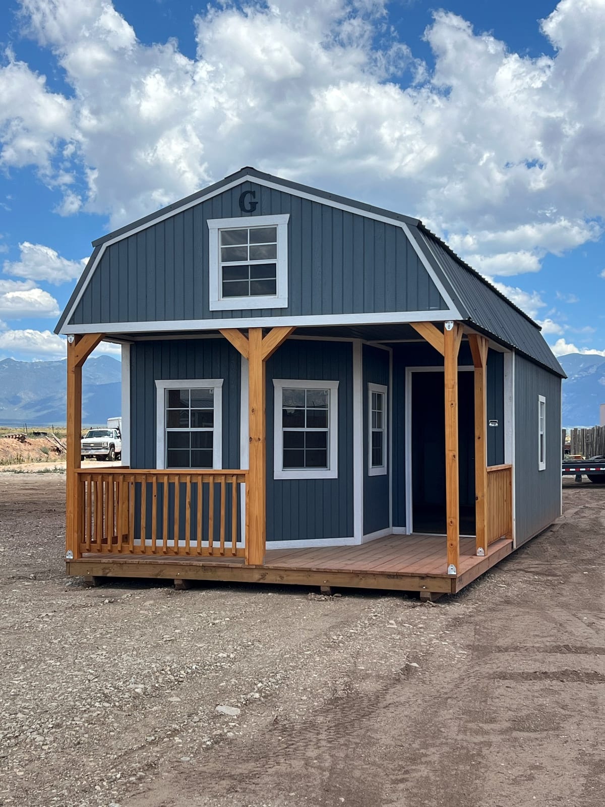 14x32 Wrap Around Porch Lofted Barn Cabin at Graceland Portable Buildings Dealer, El Prado. Taos House & Stone