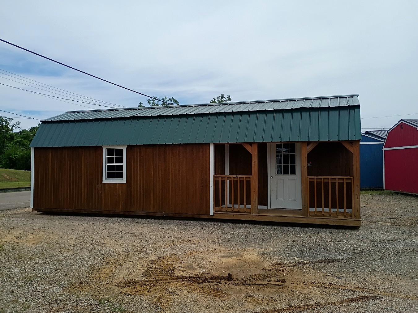 12x32 Corner Porch Lofted Barn Cabin at Jimmy's Portable Buildings of Savannah, TN