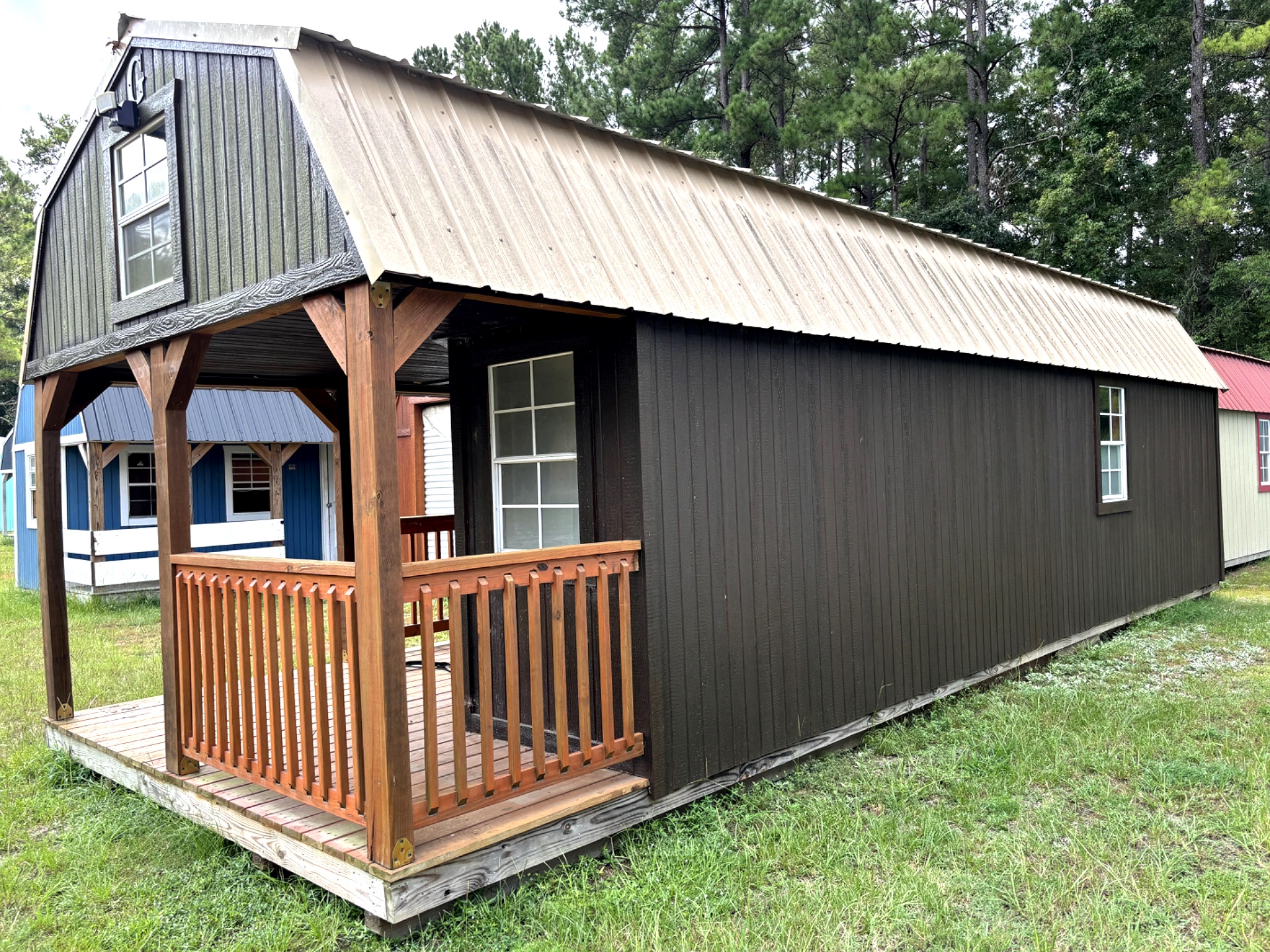 12x32 Wrap Around Porch Lofted Barn Cabin at Portable Buildings of Ravenel