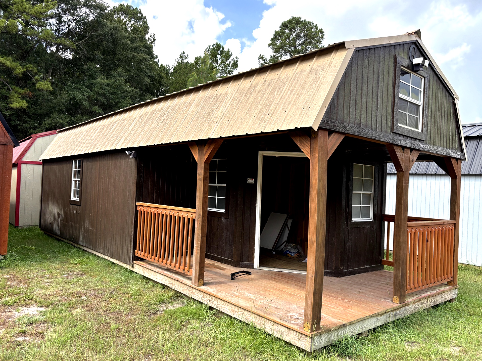 12x32 Wrap Around Porch Lofted Barn Cabin at Portable Buildings of Ravenel